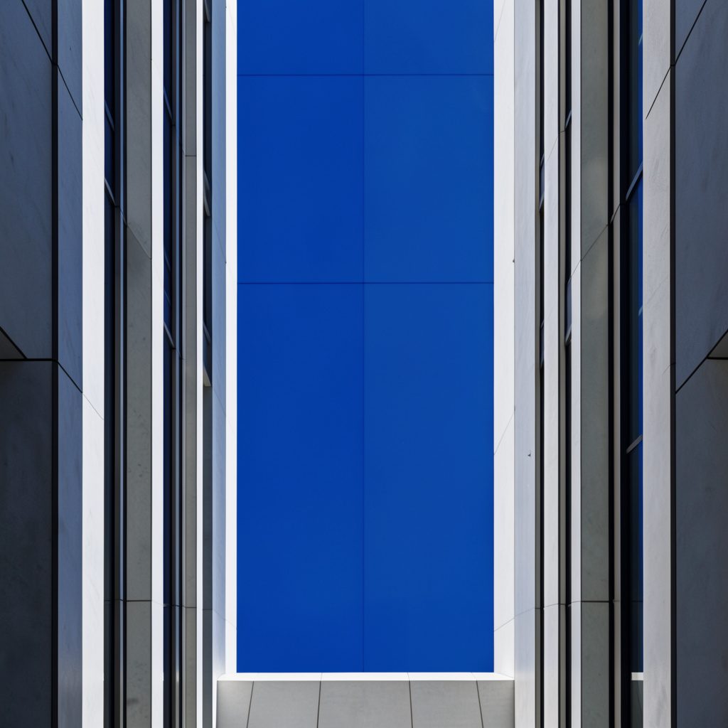Clean architectural interior with strong symmetry, soft neutral tones, and a calm orderly atmosphere